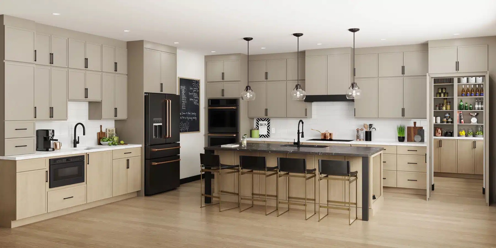 White shaker kitchen with black hardware, black countertops, and a natural wood island