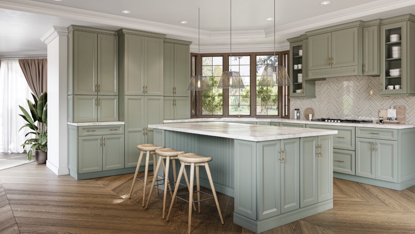 Sage green raised-panel kitchen with a marble island, brass hardware, and a herringbone tile backsplash